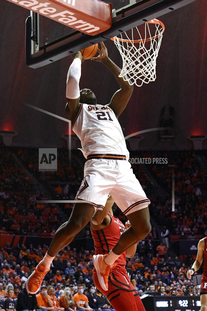 Michael Allio Illinois' Kofi Cockburn dunks during the first half of the team's NCAA college basketball game against Rutgers on Friday, Dec. 3, 2021, in Champaign, Ill. (AP Photo/Michael Allio)