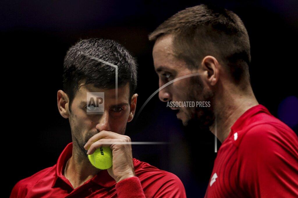 Bernat Armangue FILE - In this Nov. 22, 2019, file photo, Serbia's Novak Djokovic, left, and teammate Viktor Troicki play against Russia's Karen Khachanov and Andrey Rublev during the Davis Cup quarterfinal doubles match in Madrid, Spain. Another tennis player has tested positive for the coronavirus after taking part in an exhibition series organized by Novak Djokovic in Serbia and Croatia.
Viktor Troicki said Tuesday, June 23, 2020, that he and his pregnant wife have both been diagnosed with the virus. The former top-20 player from Serbia played against Djokovic in Belgrade during the first part of the two-leg tour.(AP Photo/Bernat Armangue, File)