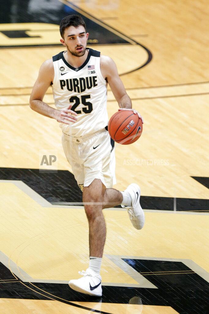 Nikos Frazier Purdue guard Ethan Morton (25) moves the ball against Oakland during the first half of an NCAA college basketball game Tuesday, Dec. 1, 2020 in West Lafayette, Ind. (Nikos Frazier/Journal & Courier via AP)