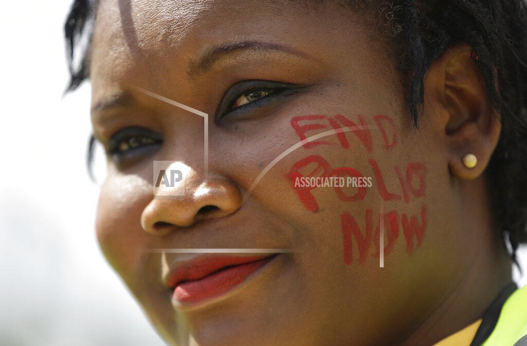Sunday Alamba FILE - In this Saturday, Aug. 27, 2016 file photo, a polio campaigner smiles during a polio vaccination exercise in Maiduguri, Nigeria. Health authorities on Tuesday, Aug. 25, 2020 are expected to declare the African continent free of the wild poliovirus after decades of effort, though cases of vaccine-derived polio are still sparking outbreaks of the paralyzing disease in more than a dozen countries. (AP Photo/Sunday Alamba, File)