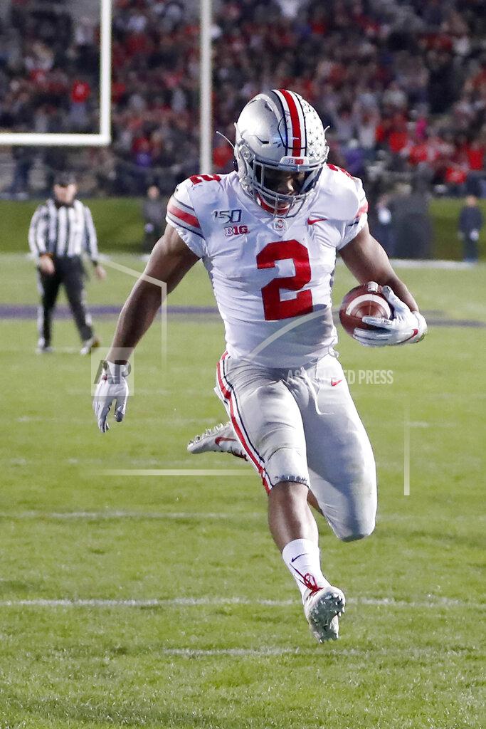 Charles Rex Arbogast Ohio State running back J.K. Dobbins scores on a pass from quarterback Justin Fields during the first half of an NCAA college football game against Northwestern, Friday, Oct. 18, 2019, in Evanston, Ill. (AP Photo/Charles Rex Arbogast)