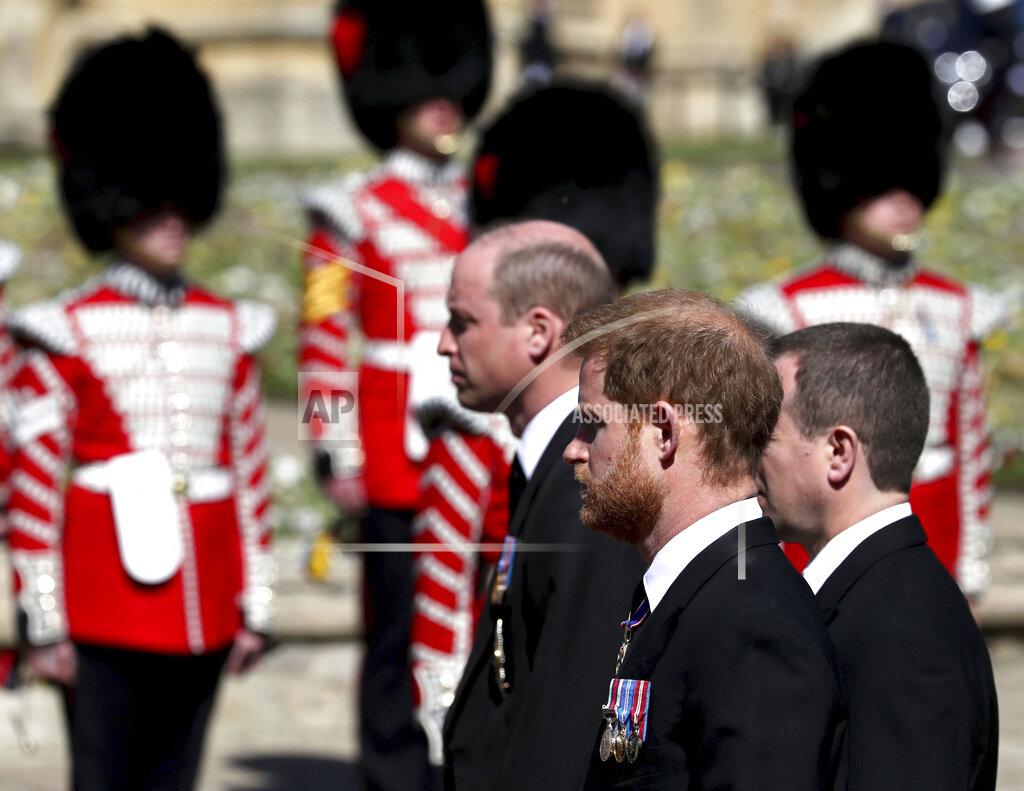 Gareth Fuller Britain's Prince William, left, and Prince Harry follow the coffin as it slowly makes its way in a ceremonial procession during the funeral of Britain's Prince Philip inside Windsor Castle in Windsor, England, Saturday, April 17, 2021. (Gareth Fuller/Pool via AP)