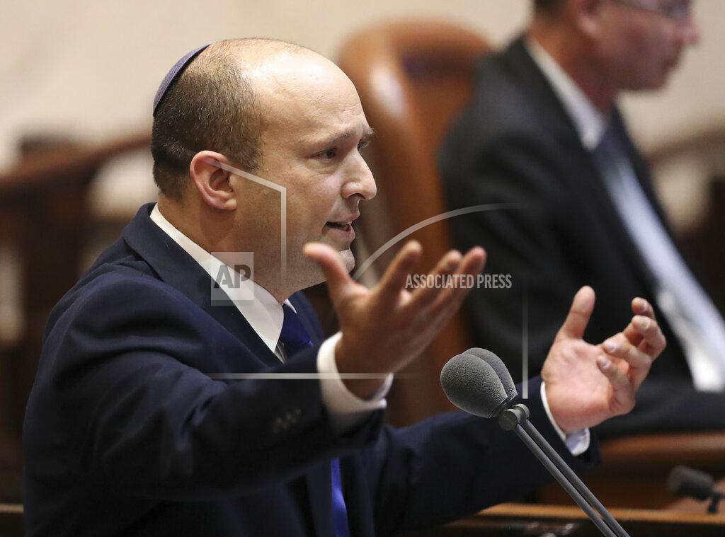 Ariel Schalit Israel's designated new prime minister, Naftali Bennett speaks during a Knesset session in Jerusalem Sunday, June 13, 2021. Bennett is expected later Sunday to be sworn in as the country's new prime minister, ending Prime Minister Benjamin Netanyahu's 12-year rule. (AP Photo/Ariel Schali22