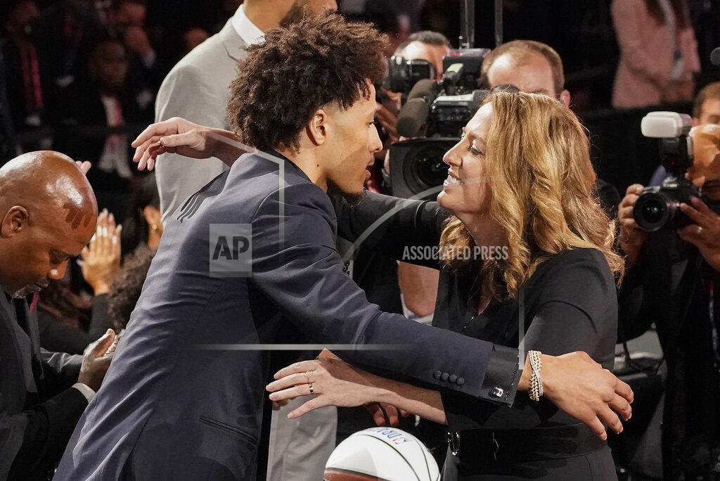 Corey Sipkin Cade Cunningham, left, hugs family and friends after being selected as the number one draft pick overall by the Detroit Pistons during the NBA basketball draft, Thursday, July 29, 2021, in New York. (AP Photo/Corey Sipkin)