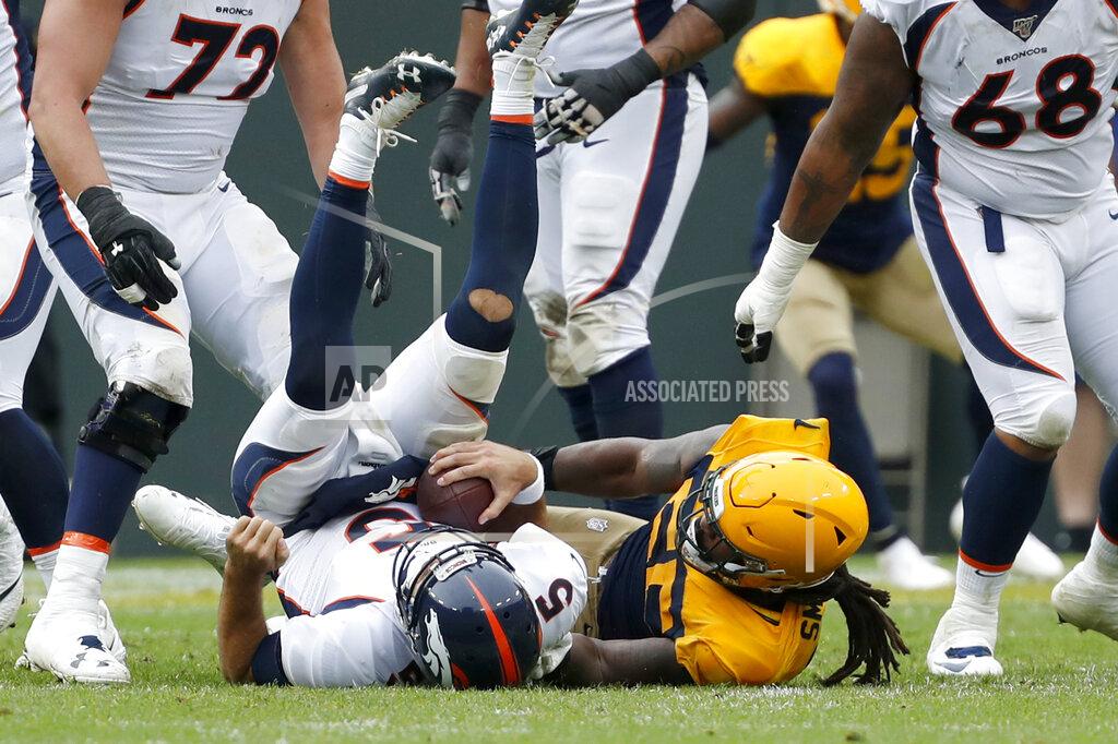 Matt Ludtke Denver Broncos quarterback Joe Flacco, left, is sacked by Green Bay Packers outside linebacker Za'Darius Smith during the first half of an NFL football game Sunday, Sept. 22, 2019, in Green Bay, Wis. (AP Photo/Matt Ludtke)