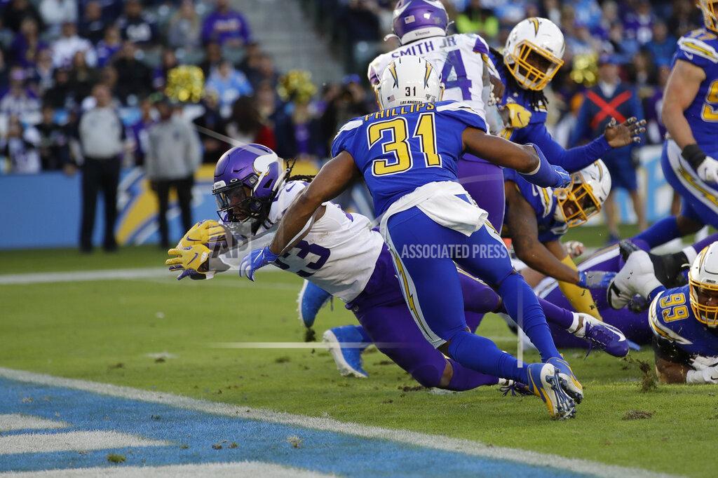 Marcio Jose Sanchez Minnesota Vikings running back Mike Boone scores a touchdown during the second half of an NFL football game against the Los Angeles Chargers,. Sunday, Dec. 15, 2019, in Carson, Calif. (AP Photo/Marcio Jose Sanchez)