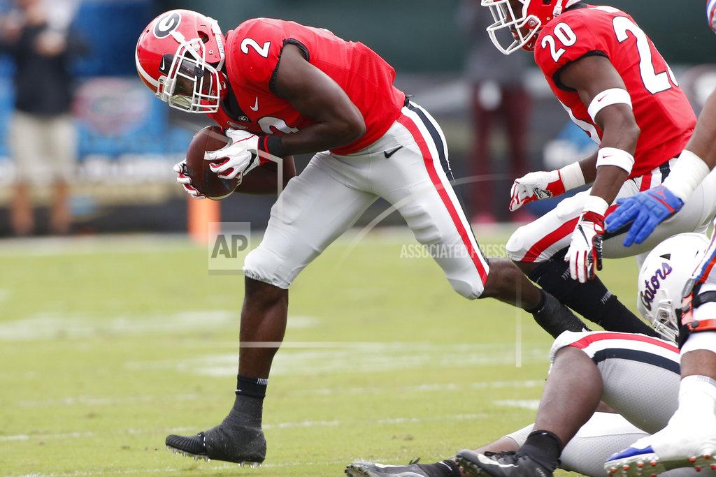 Joshua L. Jones Georgia defensive back Richard LeCounte III (2) scopes up a fumble during the first half of an NCAA college football game between Georgia and Florida at in Jacksonville, Fla. Saturday, Oct. 27, 2018. (Joshua L. Jones/Athens Banner-Herald via AP)