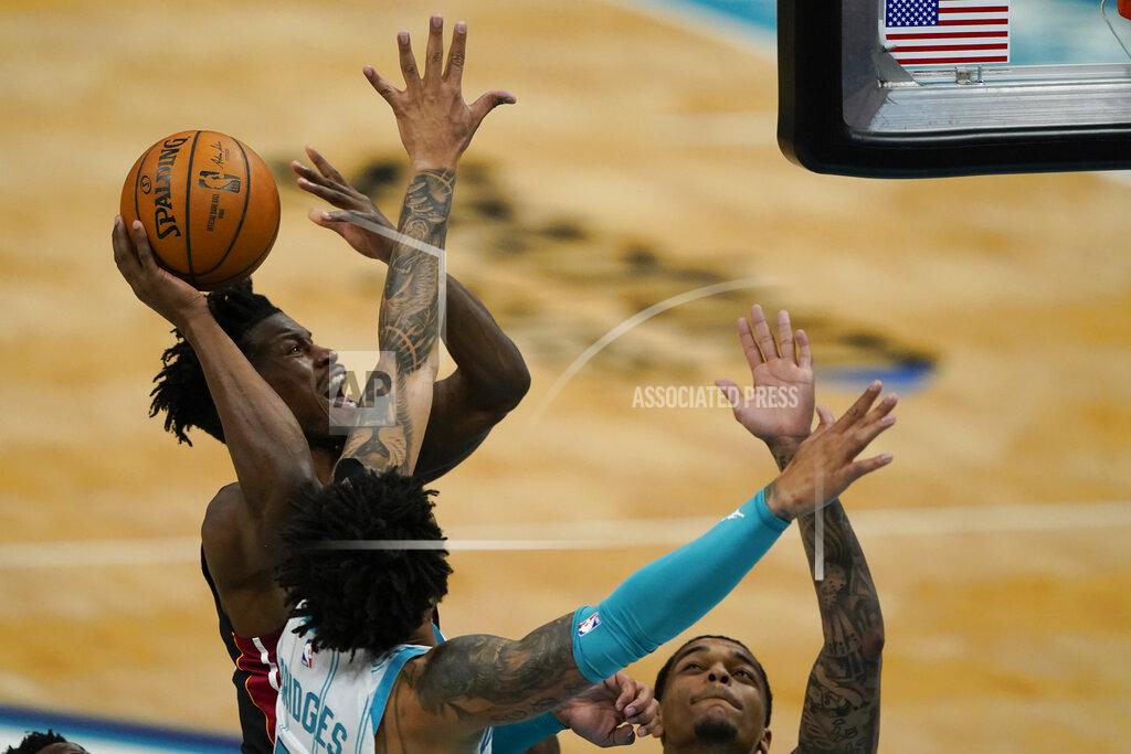 Chris Carlson Miami Heat forward Jimmy Butler shoots over Charlotte Hornets forward Miles Bridges during the first half of an NBA basketball game on Sunday, May 2, 2021, in Charlotte, N.C. (AP Photo/Chris Carlson)