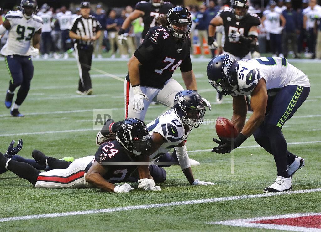 Curtis Compton Atlanta Falcons running back Devonta Freeman (24) fumbles at the Seattle Seahawks one-yard line with Seahawks linebacker Bobby Wagner recovering the ball during the fourth quarter of an NFL football game on Sunday, Oct. 27, 2019, in Atlanta. (Curtis Compton/Atlanta Journal-Constitution via AP)