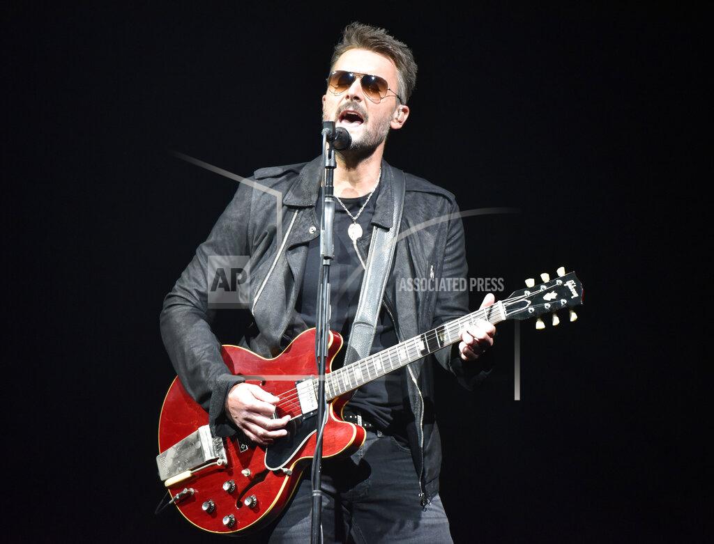 FILE - In this March 23, 2019 file photo, Eric Church performs during his Double Down tour in Rosemont, Ill. The country singer sent a message to fans in a new video that offers his belief in American resolve to overcome the pandemic. He is teasing new music, including a song called “Through My Ray Bans” from a forthcoming album. (Photo by Rob Grabowski/Invision/AP, File)