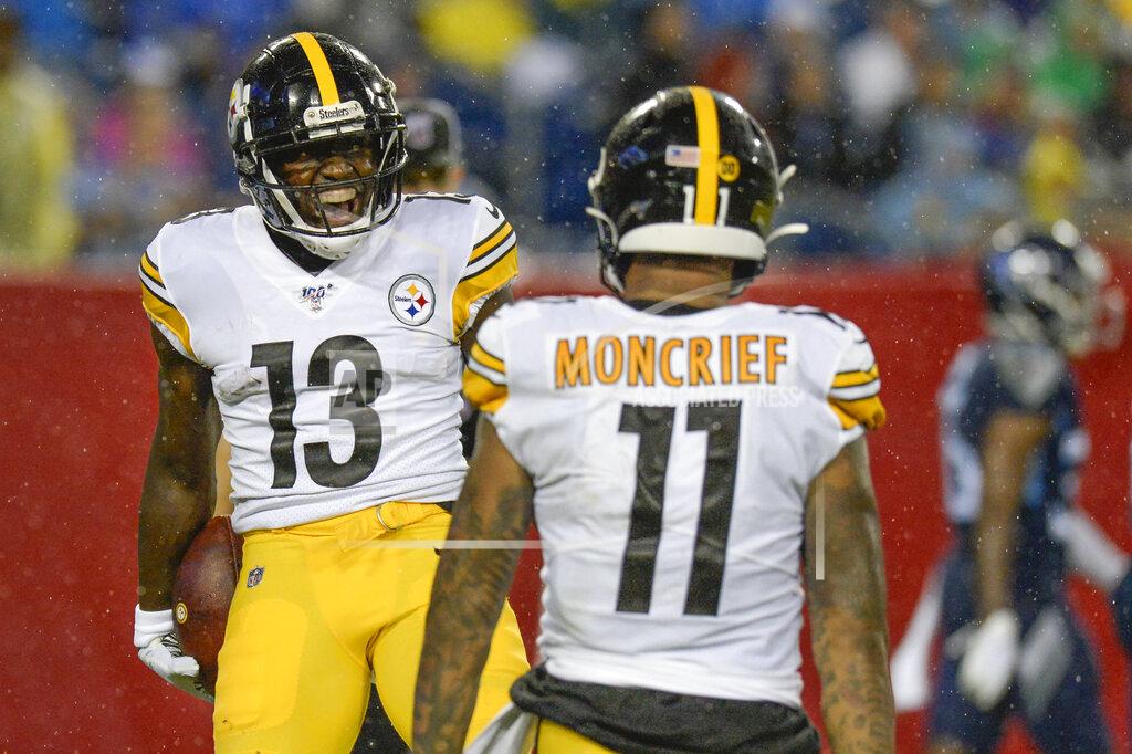 Mark Zaleski Pittsburgh Steelers wide receiver James Washington (13) celebrates with Donte Moncrief (11) after Washington scored a touchdown on a 41-yard pass play against the Tennessee Titans in the first half of a preseason NFL football game Sunday, Aug. 25, 2019, in Nashville, Tenn. (AP Photo/Mark Zaleski)