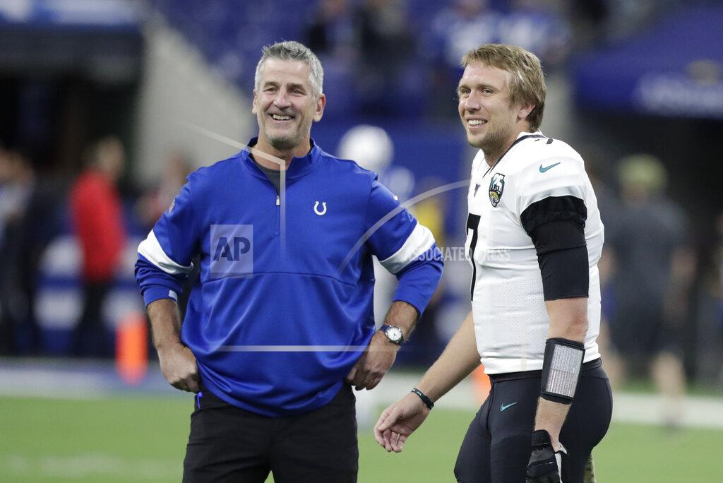 Michael Conroy Indianapolis Colts head coach Frank Reich talks with Jacksonville Jaguars quarterback Nick Foles (7) before an NFL football game, Sunday, Nov. 17, 2019, in Indianapolis. (AP Photo/Michael Conroy)