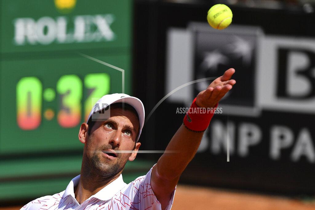 Alfredo Falcone Serbia's Novak Djokovic serves the ball to Italy's Salvatore Caruso, at the Italian Open tennis tournament in Rome, Wednesday, Sept. 16, 2020. (Alfredo Falcone/LaPresse via AP)