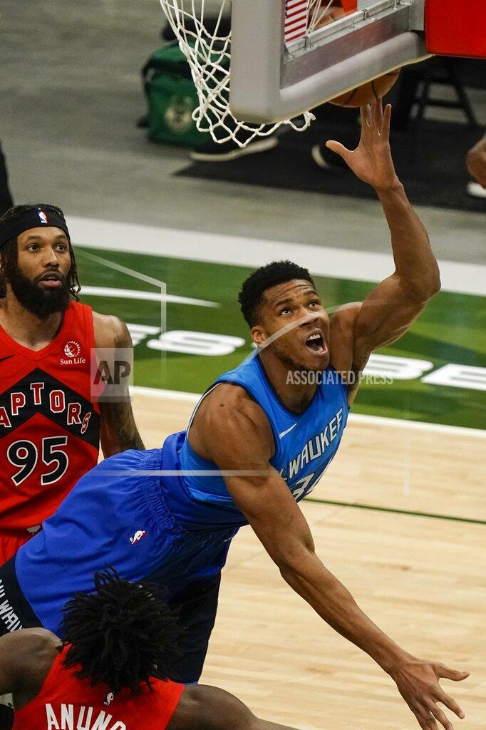 Morry Gash Milwaukee Bucks' Giannis Antetokounmpo shoots during the first half of an NBA basketball game against the Toronto Raptors Thursday, Feb. 18, 2021, in Milwaukee. (AP Photo/Morry Gash)