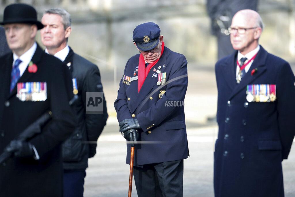 Chris Jackson Veterans stand, ahead of the start of the Remembrance Sunday service at the Cenotaph, in Whitehall, London, Sunday Nov. 8, 2020. (Chris Jackson/Pool Photo via AP)