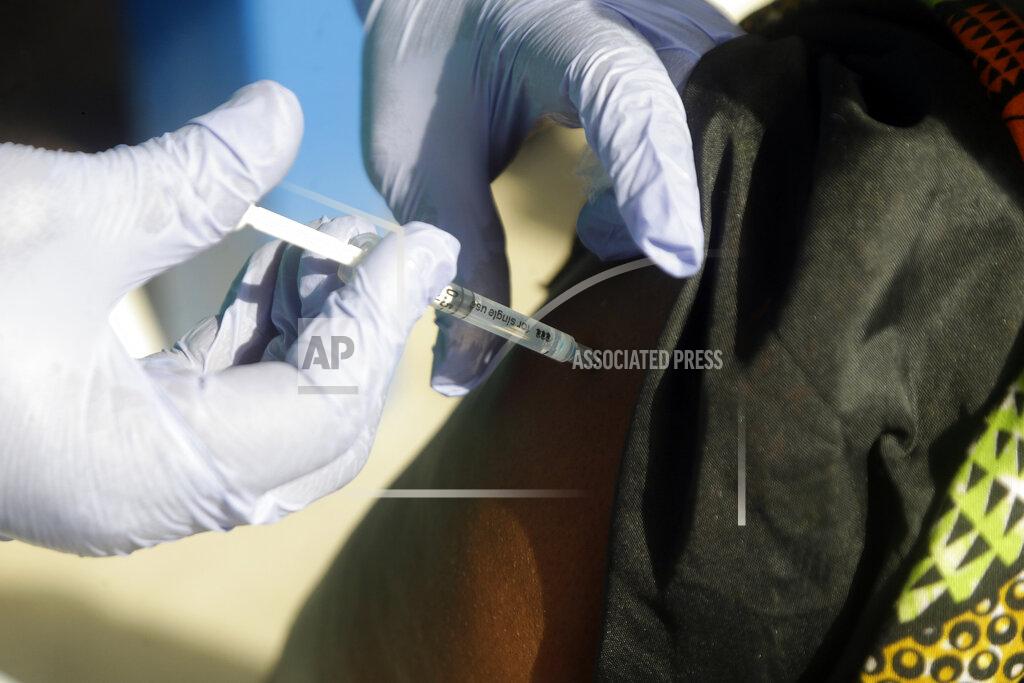 Sunday Alamba FILE - March 12, 2021, file photo, woman receives one of the country’s first coronavirus vaccinations, using the AstraZeneca vaccine provided through the global COVAX initiative, at Yaba Mainland hospital in Lagos, Nigeria. The top official with the Africa Centers for Disease Control and Prevention insisted Thursday, April 8, the AstraZeneca vaccine’s benefits outweigh its risks and that his group is not issuing new recommendations, as some countries have, amid reports of rare blood clots. (AP Photo/Sunday Alamba, File)