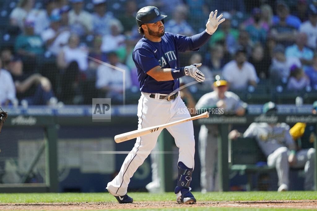 Ted S. Warren Seattle Mariners' Eugenio Suarez drops his bat after he struck out swinging to end the eighth inning of the team's baseball game against the Oakland Athletics, Wednesday, May 25, 2022, in Seattle. The Athletics won 4-2. (AP Photo/Ted S. Warren)