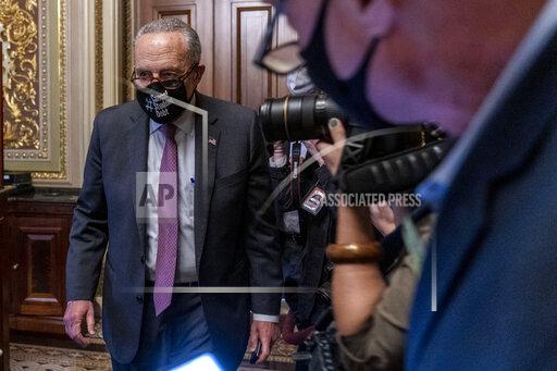 Senate Majority Leader Sen. Chuck Schumer of N.Y., leaves a Senate Democratic meeting at the Capitol in Washington, Wednesday, Oct. 6, 2021, as a showdown looms with Republicans over raising the debt limit. (AP Photo/Andrew Harnik)