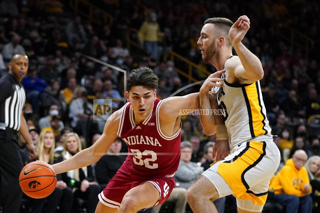 Charlie Neibergall Indiana guard Trey Galloway (32) drives to the basket past Iowa guard Connor McCaffery, right, during the first half of an NCAA college basketball game, Thursday, Jan. 13, 2022, in Iowa City, Iowa. (AP Photo/Charlie Neibergall)