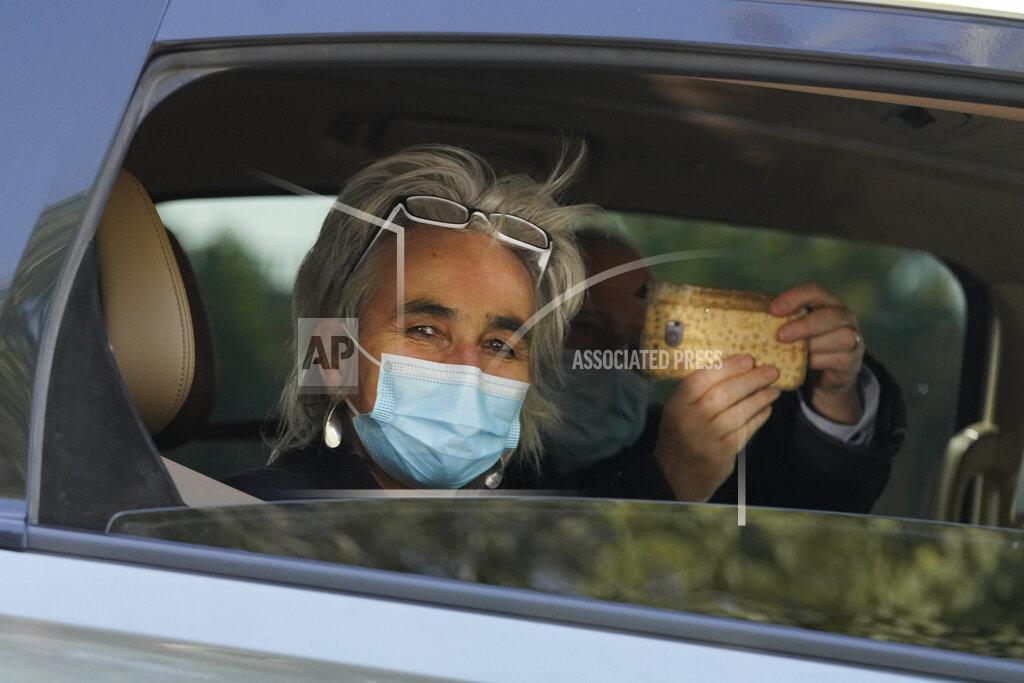 Marion Koopmans of the World Health Organization team of researchers looks out from a car during a field trip in Wuhan in central China's Hubei province on Friday, Jan. 29, 2021. The World Health Organization team of researchers emerged from their hotel Thursday for the first time since their arrival in the central Chinese city of Wuhan to start searching for clues into the origins of the COVID-19 pandemic. (AP Photo/Ng Han Guan)