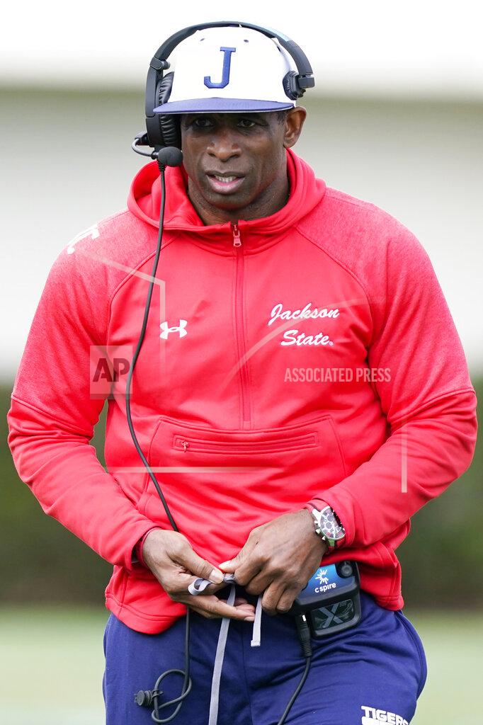 Rogelio V. Solis Jackson State football coach Deion Sanders calls out to his players during the first half of an NCAA college football against Edward Waters in Jackson, Miss., Sunday, Feb. 21, 2021. The game marks Sanders's collegiate head coaching debut. (AP Photo/Rogelio V. Solis)