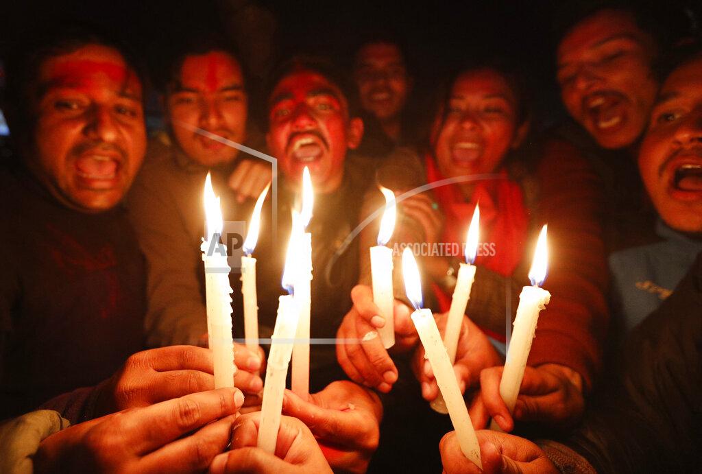 Niranjan Shrestha Nepalese supporters of the splinter group in the governing Nepal Communist Party celebrate the Supreme Court order in Kathmandu, Nepal, Tuesday, Feb. 23, 2021. Nepal's Supreme Court on Tuesday ordered the reinstatement of Parliament after it was dissolved by the prime minister, in a ruling likely to thrust the Himalayan nation into a political crisis. (AP Photo/Niranjan Shrestha)
