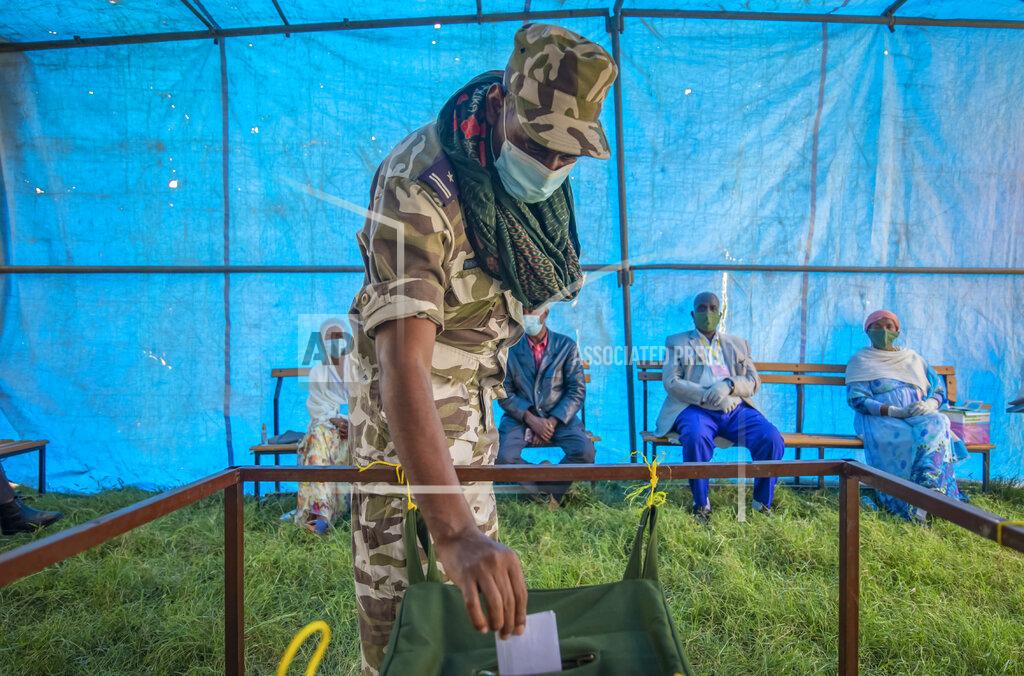 Uncredited FILE - In this Sept. 9, 2020 file photo, a member of Tigray Special Forces casts his vote in a local election in the regional capital Mekelle, in the Tigray region of Ethiopia. Ethiopia's prime minister on Wednesday, Nov. 4, 2020 ordered the military to confront the Tigray regional government after he said it attacked a military base overnight, citing months of "provocation and incitement" and declaring that "the last red line has been crossed." (AP Photo, File)