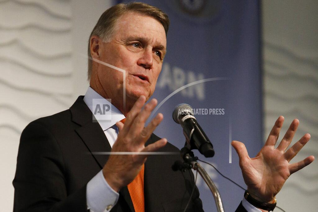 Andrea Smith FILE - In this Aug. 6, 2019, file photo, Sen. David Perdue, R-Ga., speaks during a Kiwanis Club of Atlanta luncheon. Republican Sen. David Perdue of Georgia is set to face Democrat Jon Ossoff in the first debate of their U.S. Senate race Monday afternoon, Oct. 12, 2020. (AP Photo/Andrea Smith, File)