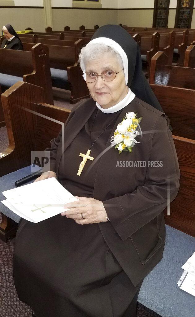 Sister Mary Jeanine Morozowich In this photo provided by Sister Mary Jeanine Morozowich, Sister Mary Evelyn Labik is recognized for her 60 years with the Felician Sisters of North America, in Greensburg, Pa., on Oct. 4, 2020. Labik contracted the coronavirus soon after and died. (Sister Mary Jeanine Morozowich via AP)