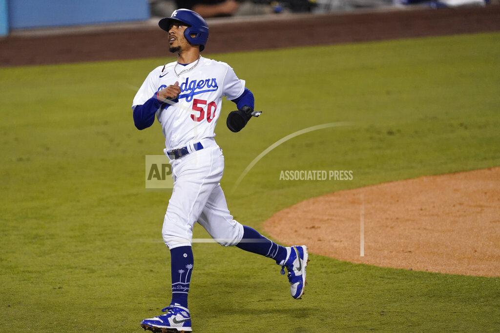 Ashley Landis Los Angeles Dodgers' Mookie Betts turns to the dugout after scoring a double steal during the first inning of the team's baseball game against the Los Angeles Angels on Friday, Sept. 25, 2020, in Los Angeles. (AP Photo/Ashley Landis)
