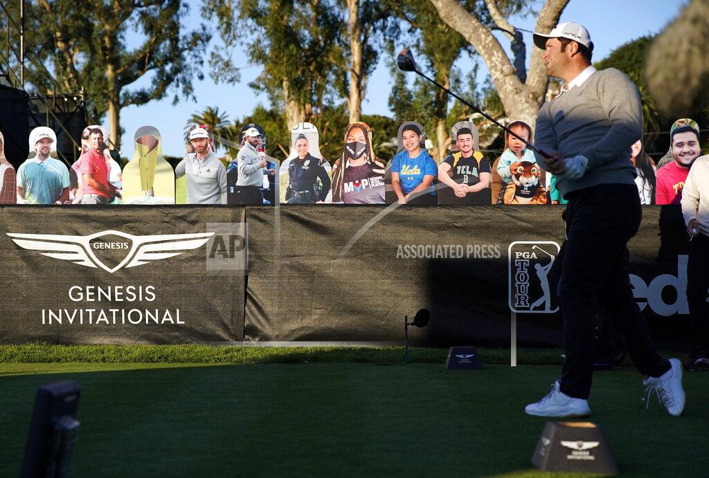 Ryan Kang Jon Rahm tees off on the 10th hole in front of cardboard cutout fans during the first round of the Genesis Invitational golf tournament at Riviera Country Club, Thursday, Feb. 18, 2021, in the Pacific Palisades area of Los Angeles. (AP Photo/Ryan Kang)