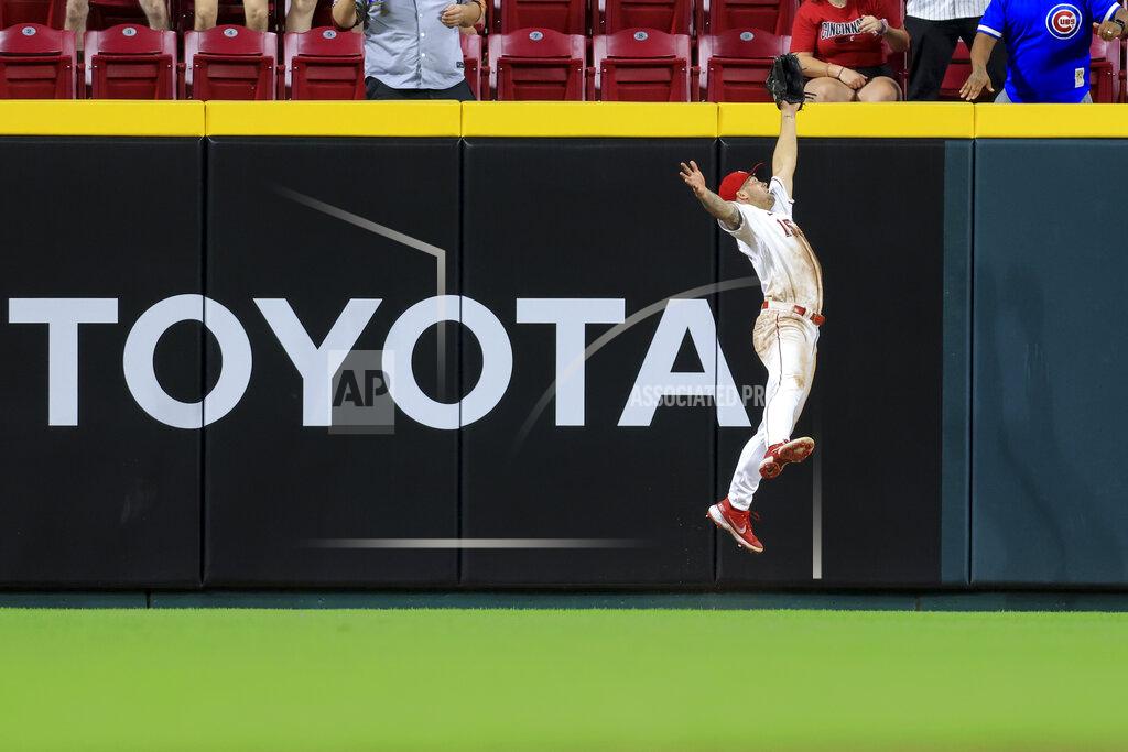 Aaron Doster Cincinnati Reds' Nick Senzel leaps at the wall to make the catch on a ball hit by Chicago Cubs' Willson Contreras during the ninth inning of a baseball game in Cincinnati, Wednesday, May 25, 2022. The Reds won 4-3. (AP Photo/Aaron Doster)