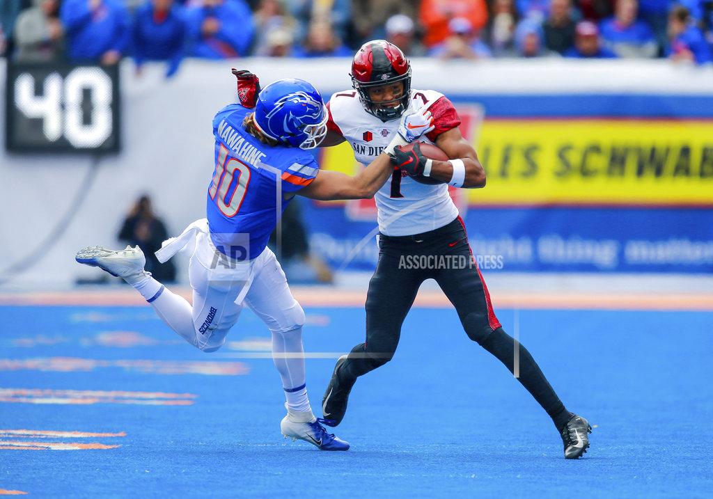 Steve Conner San Diego State wide receiver Fred Trevillion (7) tries to separate from Boise State safety Kekoa Nawahine (10) after a reception in the first half of an NCAA college football game, Saturday, Oct. 6, 2018, in Boise, Idaho. (AP Photo/Steve Conner)