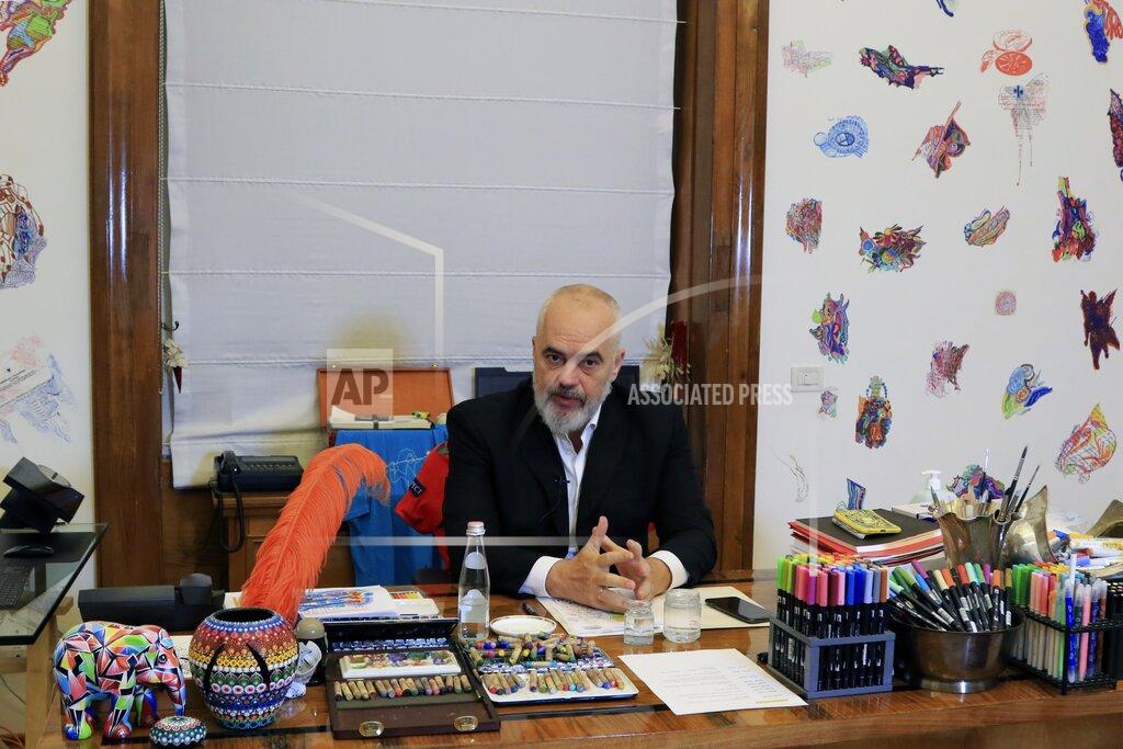 Hektor Putsina Albania's Prime Minister Edi Rama speaks during an interview with the Associated Press in Tirana, Wednesday, May 6, 2020. Western Balkan countries are optimistic in their European path, also looking forward to the bloc's post-pandemic assistance to cope with their increased economic difficulties. (AP Photo/Hektor Pustina)