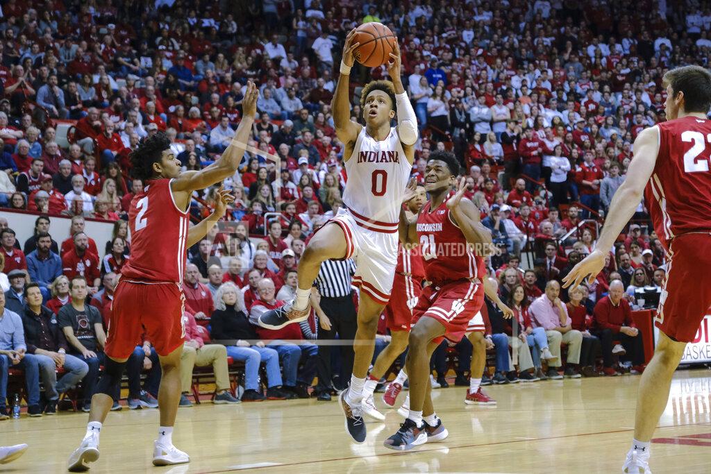 Aj Mast Indiana guard Romeo Langford (0) shoots in front of Wisconsin guard Khalil Iverson (21) during the second half of an NCAA college basketball game in Bloomington, Ind., Tuesday, Feb. 26, 2019. Indiana won 75-73 in double overtime. (AP Photo/AJ Mast)