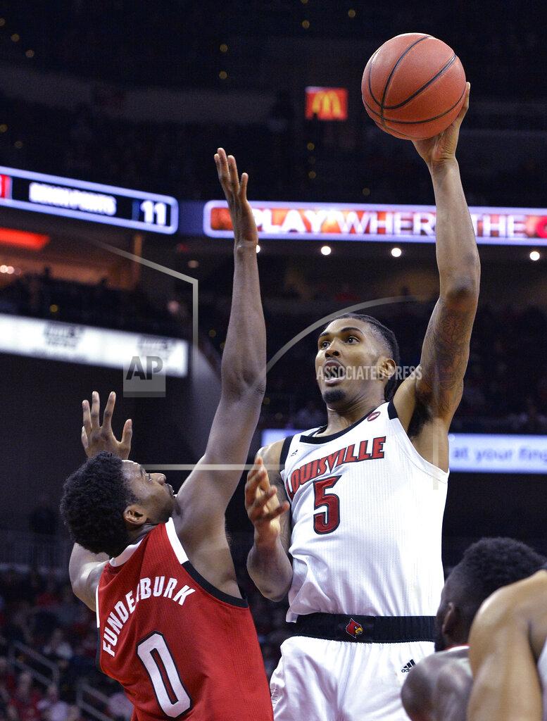 Timothy D. Easley Louisville center Malik Williams (5) shoots over North Carolina State forward DJ Funderburk during the second half of an NCAA college basketball game in Louisville, Ky., Thursday, Jan. 24, 2019. Louisville won 84-77. (AP Photo/Timothy D. Easley)