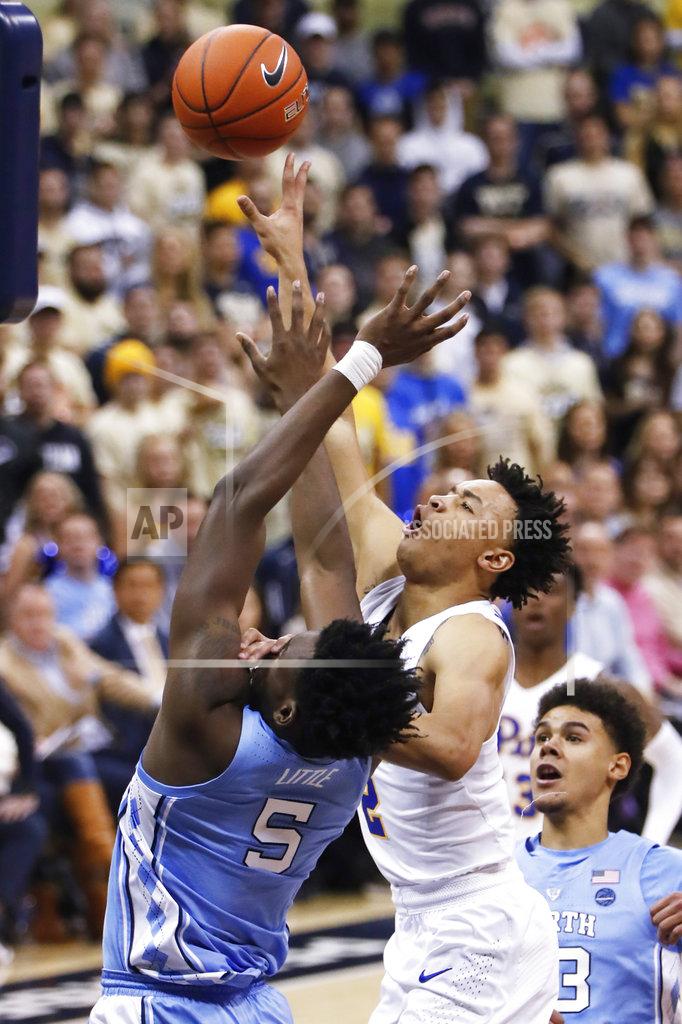 Keith Srakocic Pittsburgh's Trey McGowens, right, shoots over North Carolina's Nassir Little during the first half of an NCAA college basketball game, Saturday, Jan. 5, 2019, in Pittsburgh. (AP Photo/Keith Srakocic)