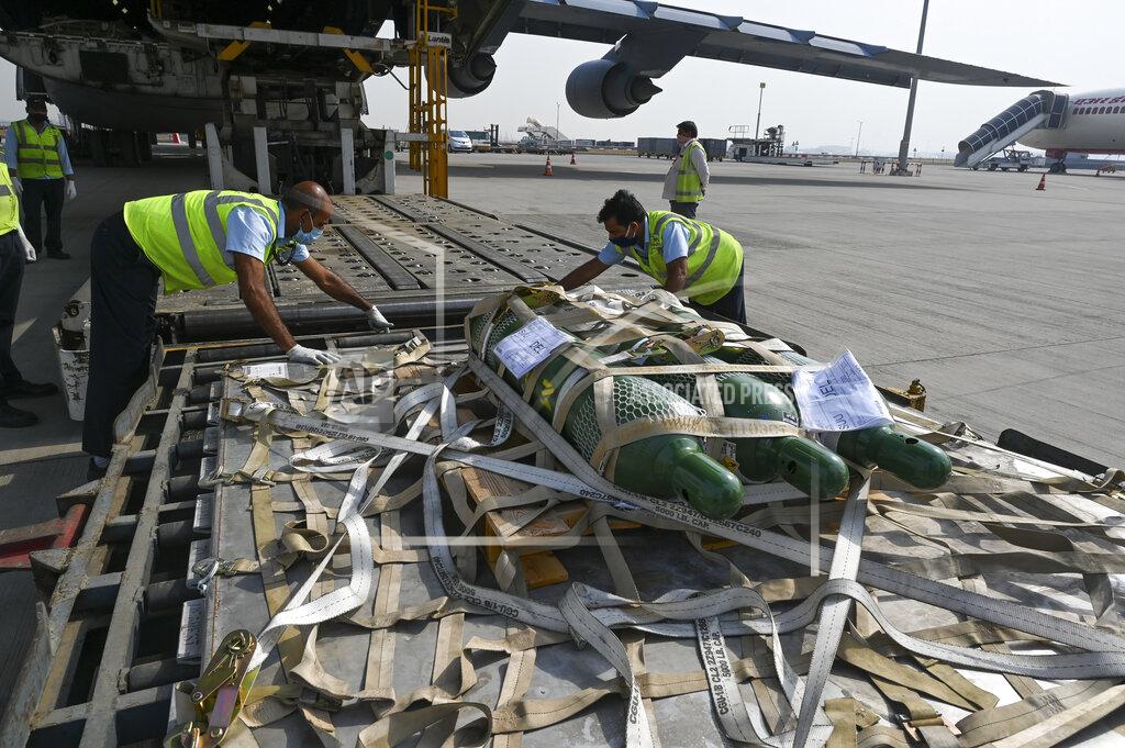 Prakash Singh FILE - In this April 30, 2021, file photo, relief supplies from the United States in the wake of India's COVID-19 situation arrive at the Indira Gandhi International Airport cargo terminal in New Delhi, India. India’s large diaspora is tapping its wealth, growing political clout and expertise to help India combat a catastrophic coronavirus surge that has led to desperate pleas for oxygen and left people to die outside overwhelmed hospitals. (Prakash Singh/Pool via AP, File)