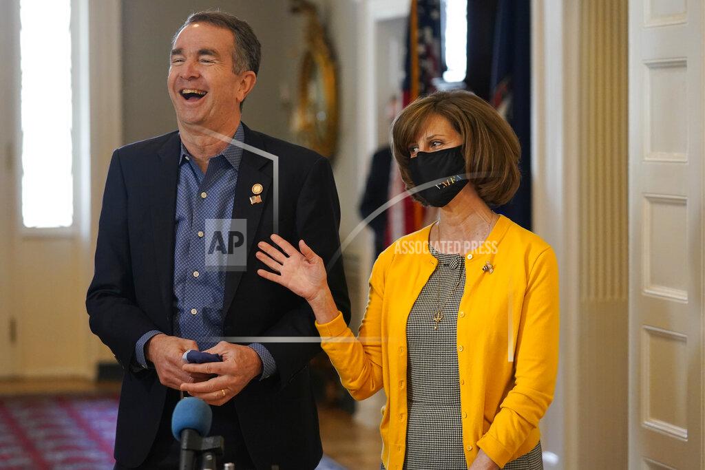 Steve Helber Virginia Gov. Ralph Northam, left, shares a laugh with First Lady Pam Northam as they prepare to receive a COVID-19 vaccine at the Governor's Mansion in Richmond, Va., Monday, March 15, 2021. The Northam's got a shot of the Johnson & Johnson coronavirus vaccine, joining the growing number of Virginians who are being inoculated against the potentially deadly disease. (AP Photo/Steve Helber)