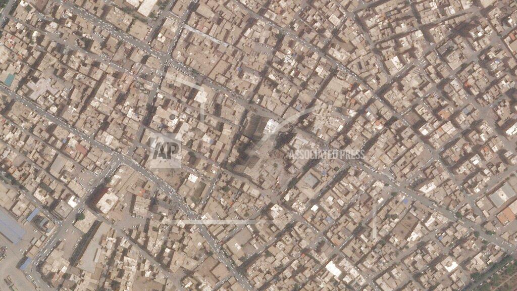 Planet Labs Pbc This satellite photo from Planet Labs PBC shows the Metropol Building collapse site, center, in Abadan, Iran, Thursday, May 26, 2022. Iranian riot police fired tear gas and shot into the air to disperse an angry crowd of hundreds of people near the site of the building collapse in the southwestern city of Abadan, online video analyzed Saturday, May 28, 2022, showed. (Planet Labs PBC via AP)