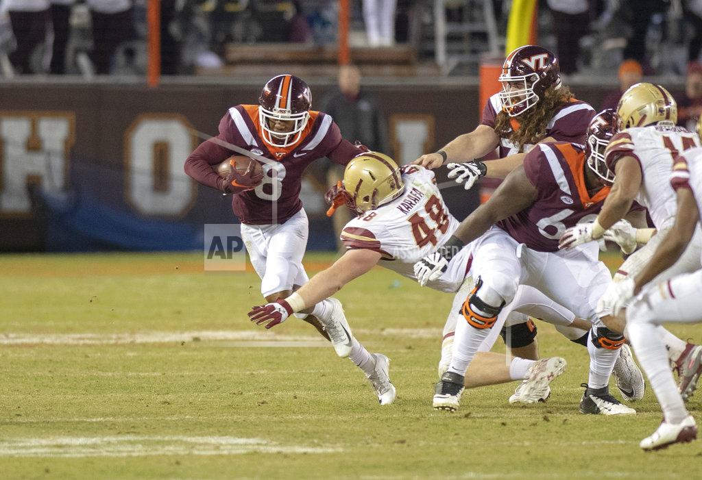 Matt Bell Virginia Tech wide receiver Phil Patterson avoids the tackle by Boston College defensive tackle Tanner Karafa during an NCAA college football game in Blacksburg, Va., Saturday, Nov. 3, 2018. (AP Photo/Matt Bell)