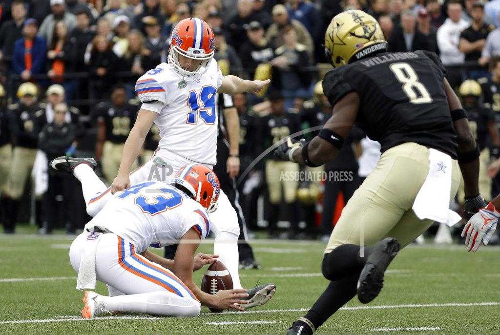 Mark Humphrey Florida place kicker Evan McPherson (19) kicks a 25-yard field goal as Vanderbilt cornerback Joejuan Williams (8) rushes in the first half of an NCAA college football game Saturday, Oct. 13, 2018, in Nashville, Tenn. (AP Photo/Mark Humphrey)
