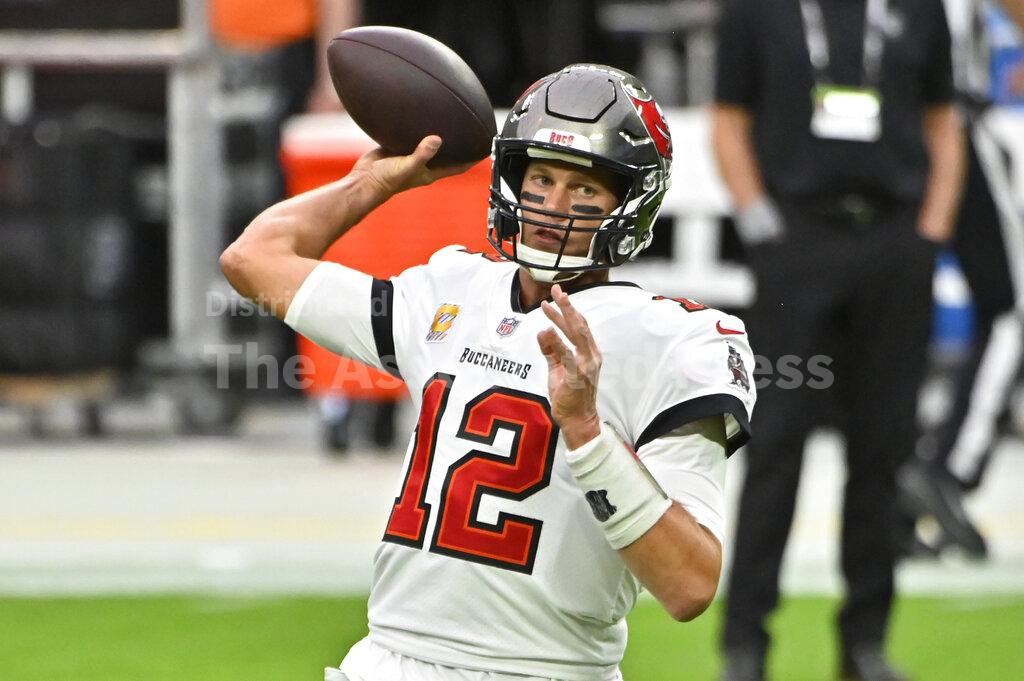 Tampa Bay Buccaneers quarterback Tom Brady (12) warms up before an NFL football game against the Las Vegas Raiders, Sunday, Oct. 25, 2020, in Las Vegas. (AP Photo/David Becker)