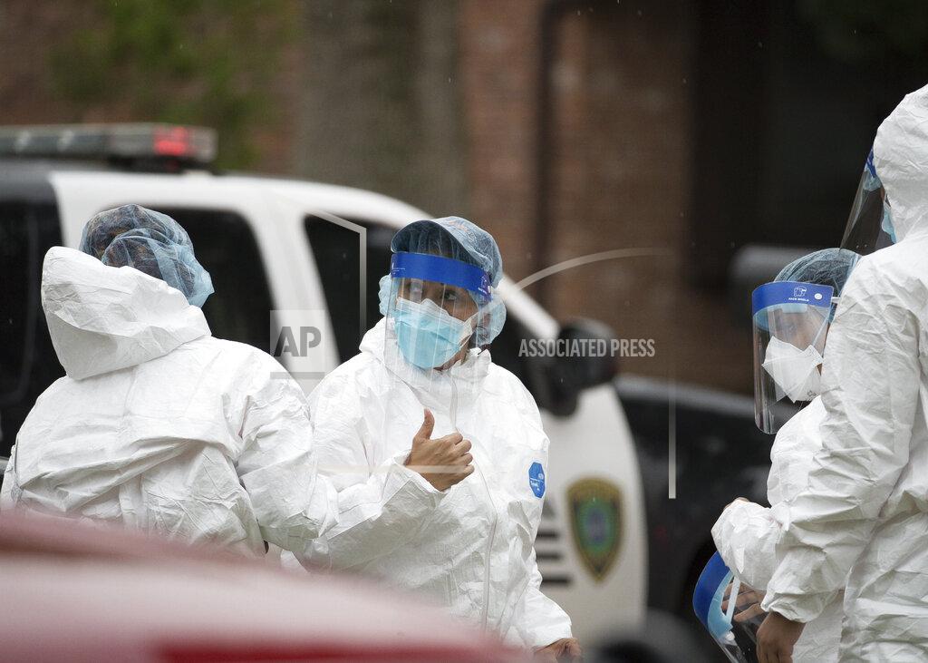 Godofredo A. Vásquez Emergency personnel don PPE before entering the home where more than 90 undocumented immigrants were found on the 12200 block of Chessington Drive, Friday, April 30, 2021, in Houston. A Houston Police official said the case will be handled by federal authorities and that some of the people inside the house were exhibiting COVID-19 symptoms. ( Godofredo A. Vásquez/Houston Chronicle via AP)