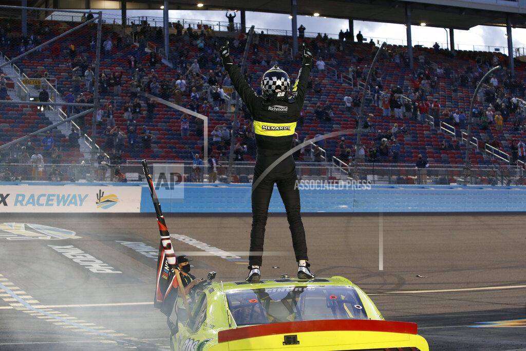 Ralph Freso Austin Cindric stands on the roof of his race car to acknowledge the crowd after winning the season championship and a NASCAR Xfinity Series auto race at Phoenix Raceway, Saturday, Nov. 7, 2020, in Avondale, Ariz. (AP Photo/Ralph Freso)