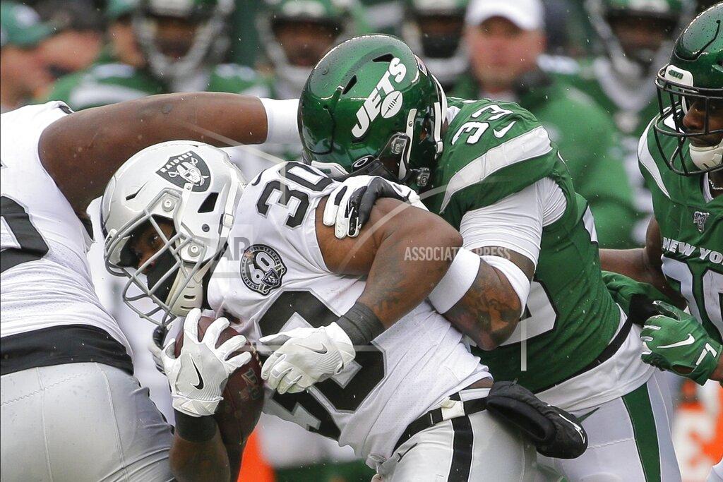 Seth Wenig New York Jets' Jamal Adams (33) tackles Oakland Raiders' DeAndre Washington (33) during the first half of an NFL football game Sunday, Nov. 24, 2019, in East Rutherford, N.J. (AP Photo/Seth Wenig)
