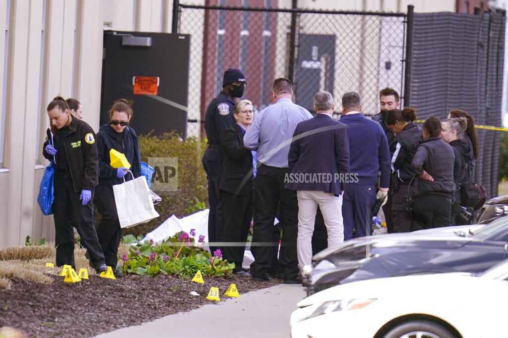 Michael Conroy Authorities confer at the scene where multiple people were shot at the FedEx Ground facility early Friday morning, April 16, 2021, in Indianapolis. A gunman killed several people and wounded others before taking his own life in a late-night attack at a FedEx facility near the Indianapolis airport, police said. (AP Photo/Michael Conroy)
