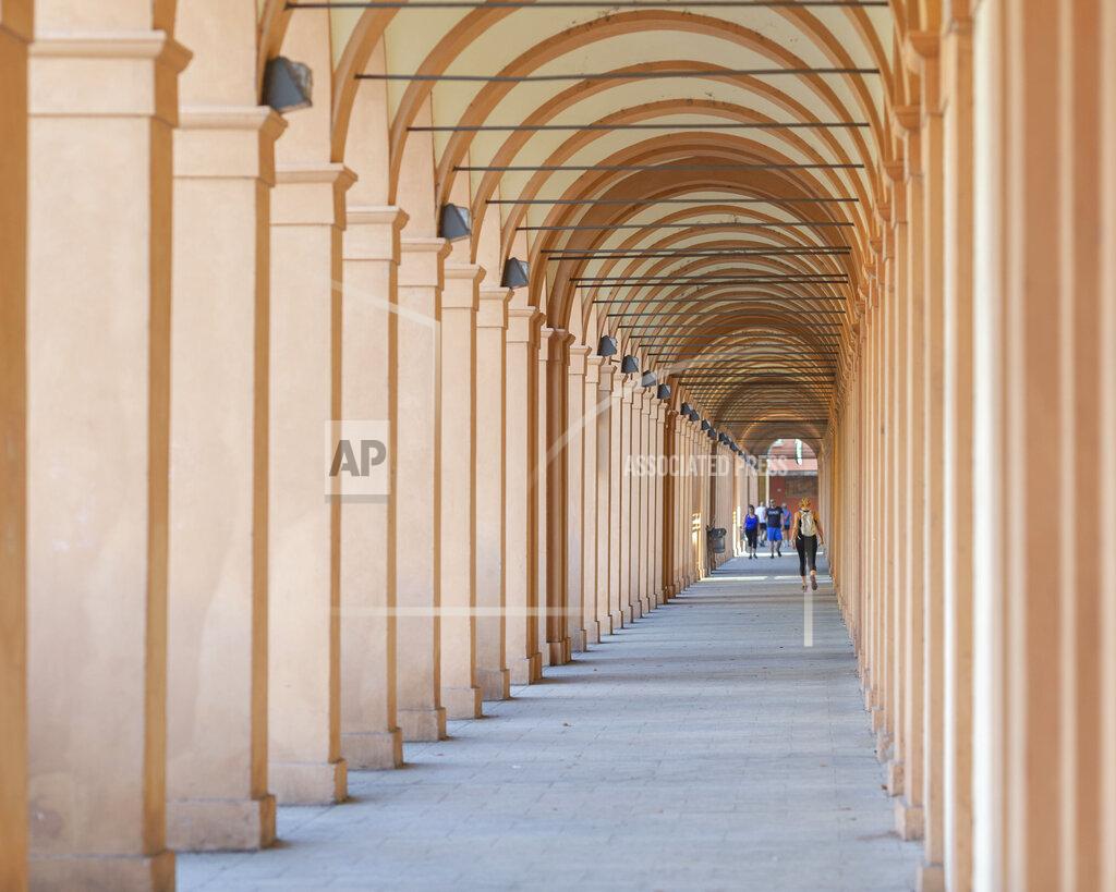 Guido Calamosca A view of the porticoes in Bologna, Italy, Wednesday, July 28, 2021. Bologna's 12th-century porticoes, still part of the city's everyday life, have been added to the World Heritage List. At a meeting in China on Wednesday, the World Heritage Committee of UNESCO, the U.N. culture agency, inscribed the porticoes on the prestigious list. The addition raises to 58 the number of Italian sites on the list. (Guido Calamosca/LaPresse via AP)