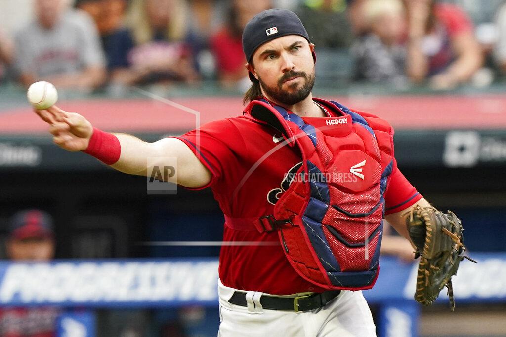 Tony Dejak Cleveland Indians catcher Austin Hedges throws out Tampa Bay Rays' Austin Meadows at first base after a dropped third strike during the third inning of a baseball game, Thursday, July 22, 2021, in Cleveland. (AP Photo/Tony Dejak)