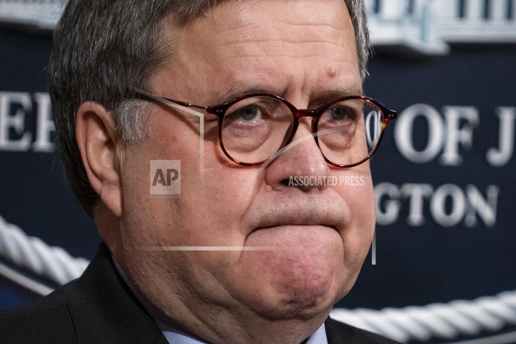 J. Scott Applewhite FILE - In this Jan. 13, 2020, file photo Attorney General William Barr speaks to reporters at the Justice Department in Washington. The FBI has found a link between the gunman in a deadly attack at a military base last December and an al-Qaida operative. That's according to a U.S. official who spoke to The Associated Press on Monday. (AP Photo/J. Scott Applewhite, File)